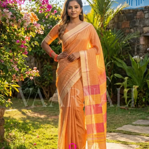 Model wearing yellow red patteda anchu saree outdoor garden setting pure handloom cotton VAARNALI