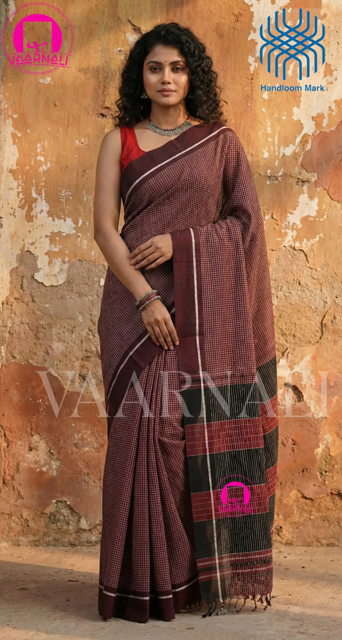 Model draped in Chocolate Patteda Anchu Saree with traditional jewelry styling