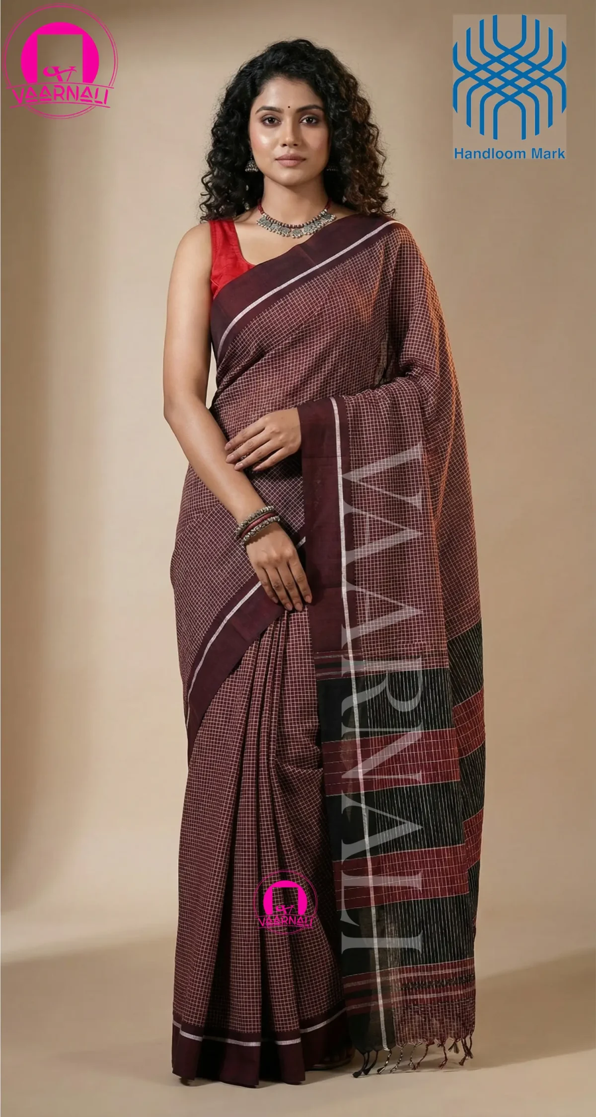 Pure handloom cotton fabric texture of maroon Patteda Anchu saree showing weave pattern