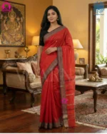 Close up of intricate black border with geometric motifs on red cotton saree traditional Dhonekhali handloom work