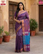 Woman wearing purple Bishnupuri katan silk saree at Indian wedding with gold jewelry