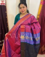 Woman wearing pink bindu buti Bishnupuri silk saree at Indian wedding celebration