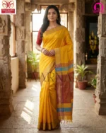 Close-up of pure Bishnupuri katan silk fabric showing lustrous yellow weave and authentic handloom quality