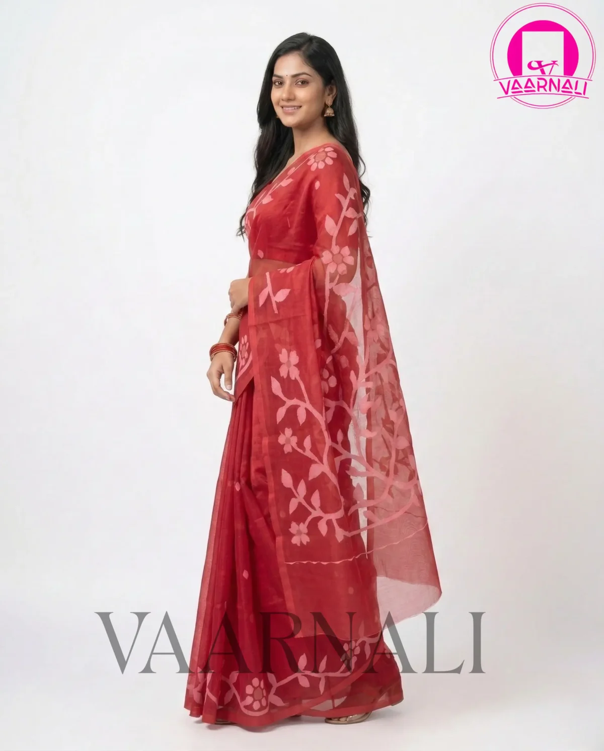VAARNALI's Red Muslin Saree styled traditionally for a festive occasion with antique gold jewelry, perfect for a traditional Muslin Saree look.