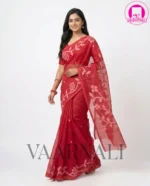 Model gracefully draped in VAARNALI's exquisite Red Muslin Saree, highlighting its sheer elegance and vibrant color.