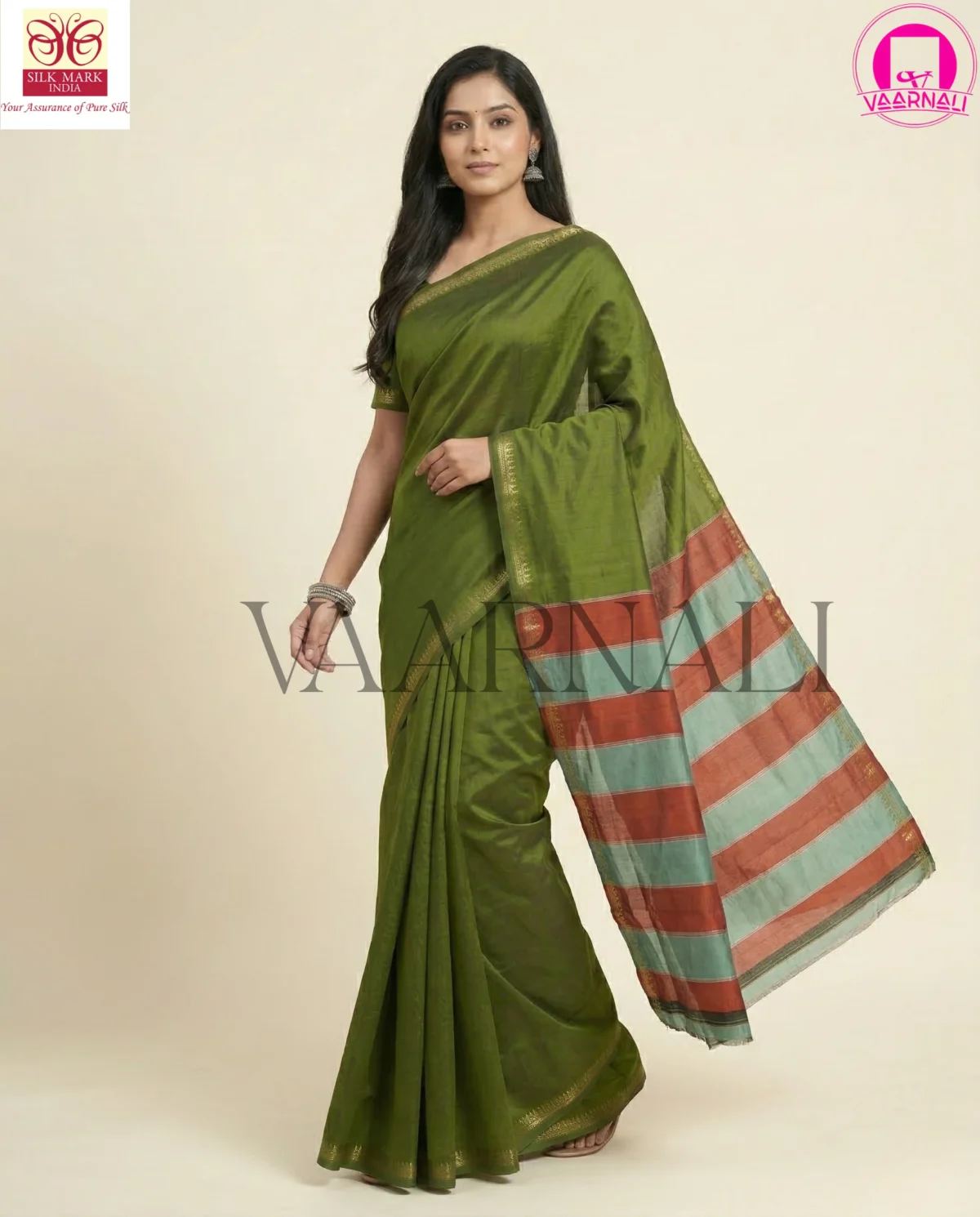 Flowing drape of VAARNALI Moss Green Pure Silk Saree on mannequin, showcasing elegant fall and one colour silk design.
